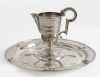 Set of jug and saucer, in Spanish silver following antique