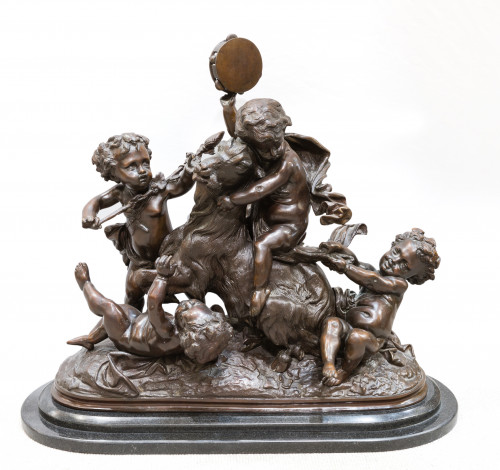 "Niños jugando con una cabra", escultura de bronce patinado