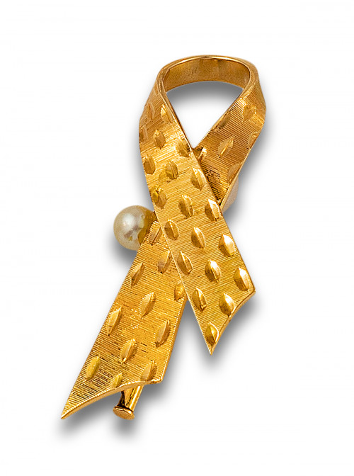 BROCHE, AÑOS 70, LAZO DE ORO AMARILLO Y PERLA CULTIVADA