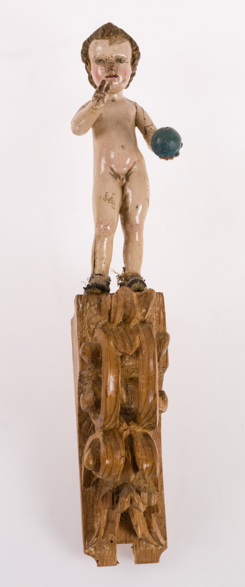 "Niño Jesús bendiciendo el mundo", figura tallada sobre mén