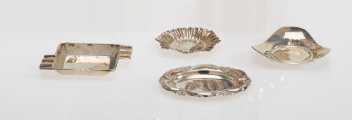 Three silver ashtrays and one silver metal ashtray, 20th ce