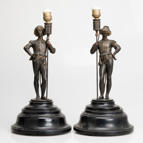 Pair of table lamps with medieval figures in patinated meta
