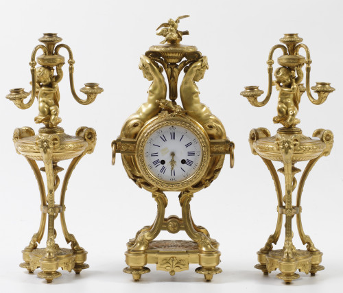 Clock garrison and two Louis XVI style gilt bronze candelab