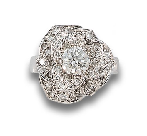 GOLD RING WITH DIAMOND ON A EDGE OF PETALS SET WITH DIAMOND