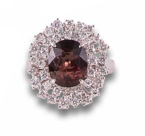 ART DECO STYLE HALO RING IN PLATINUM WITH DIAMONDS AND RUBI