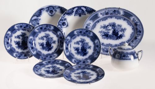 Oval serving dish, two large plates, five small plates, and