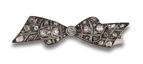 Antique diamond bow brooch, in gold and silver