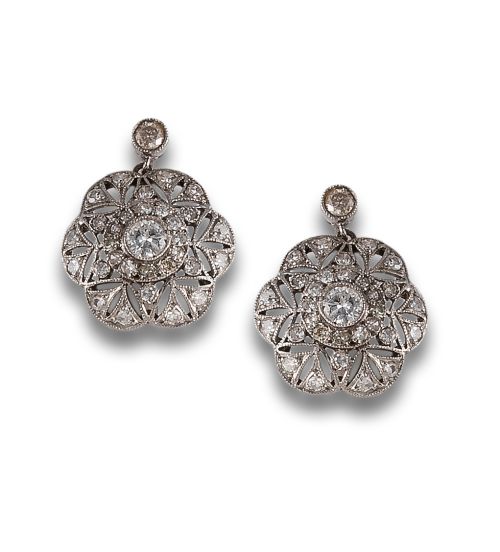 Long, antique-style diamond earrings in platinum
