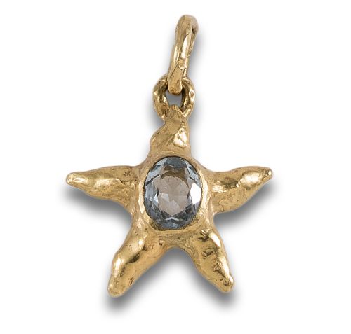 COLGANTE EN FORMA DE ESTRELLA EN ORO Y TOPACIO
