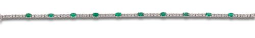 PULSERA RIVIERE DE DIAMANTES Y ESMERALDAS, EN ORO BLANCO