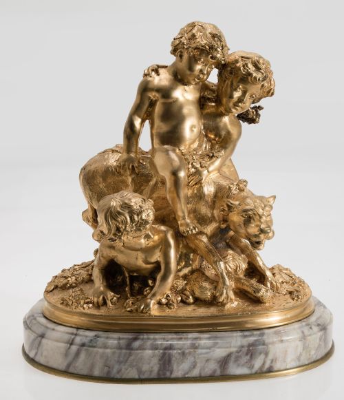 Niños de bronce doradop y base de mármol