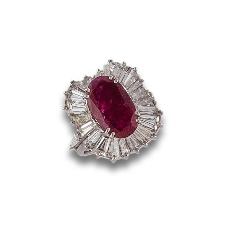 PLATINUM RING WITH RUBY IN A DANCER BORDER OF DIAMONDS