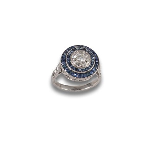 SORTIJAOJO DE PERDIZ DE PLATINO, ZAFIRO Y DIAMANTES.