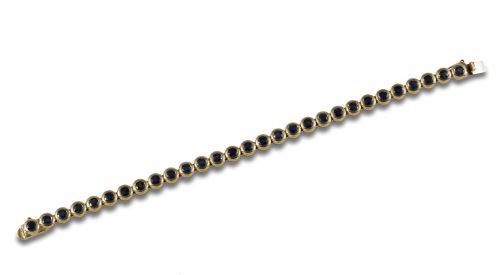 GOLD RIVIERE BRACELET WITH ROUND CUT SAPPHIRES