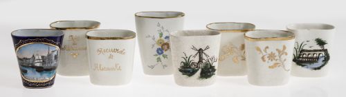 Eight pottery or porcelain pottery glasses, early 20th cent