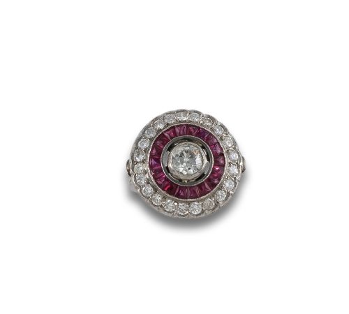 PLATINUM BITCH'S EYE RING WITH RUBIES AND DIAMONDS