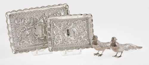 Two embossed silver trays