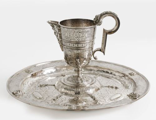 Set of jug and saucer, in Spanish silver following antique